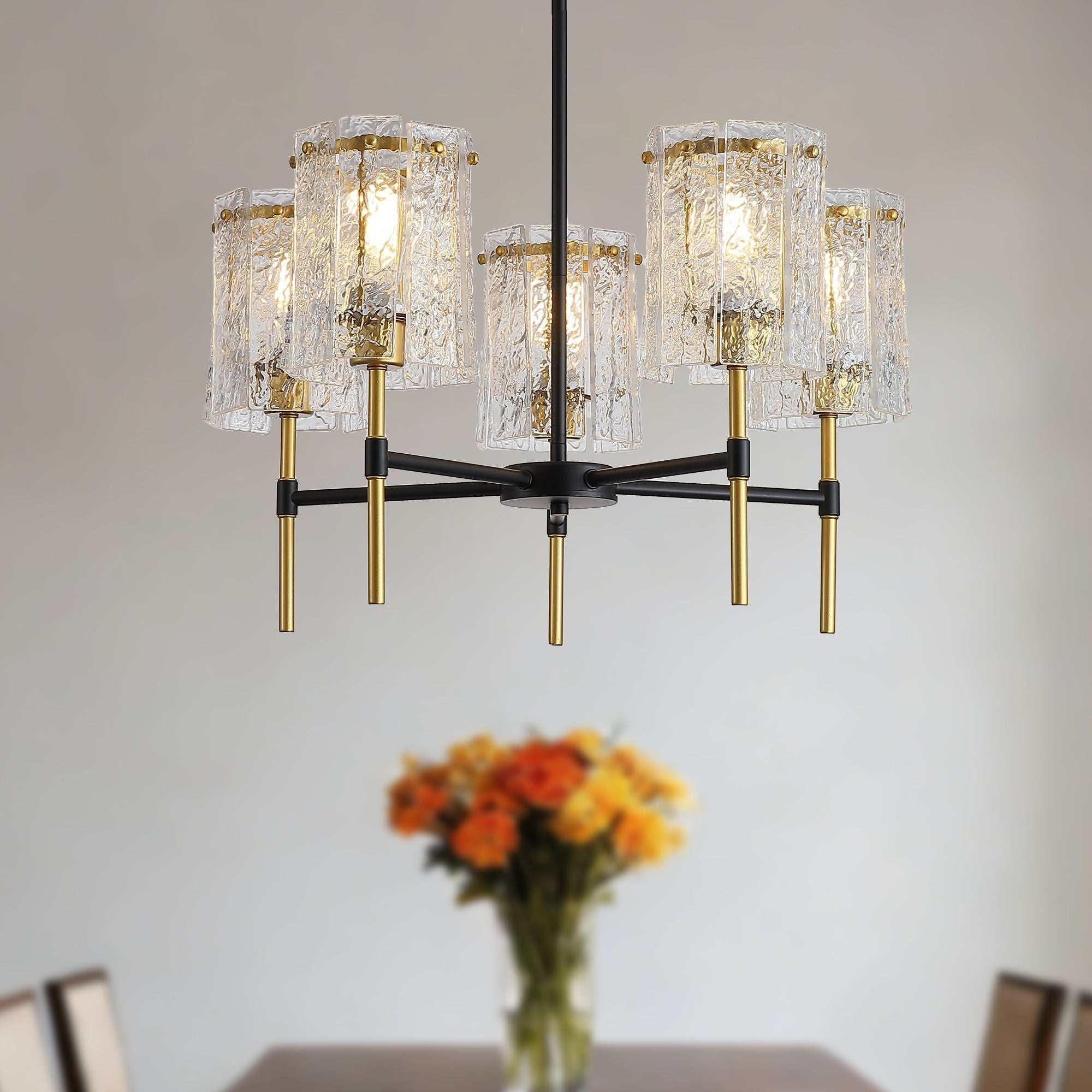 5 light chandelier with black iron frame, gold accents, and textured glass pendant lights for living room