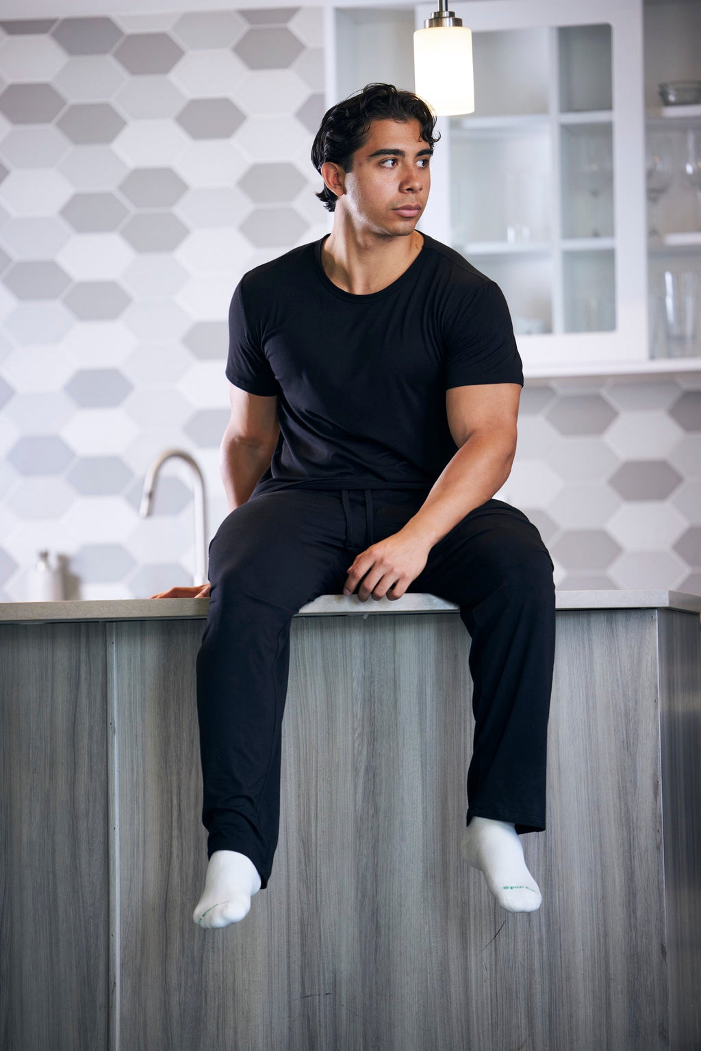 Men wearing soft bamboo lounge pajama set with short sleeve top and pants