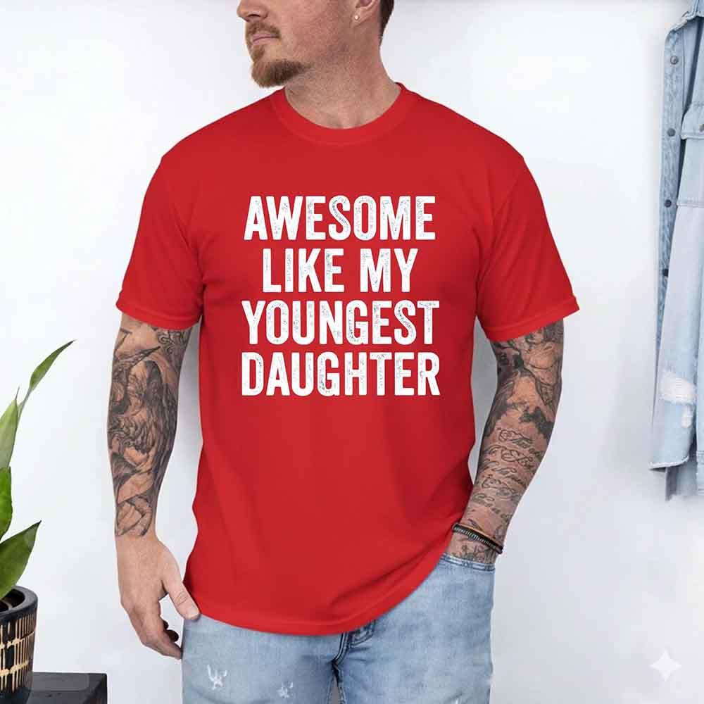 Black Awesome Like My Youngest Daughter Shirt with playful white text, casual unisex design for parents, soft cotton fabric