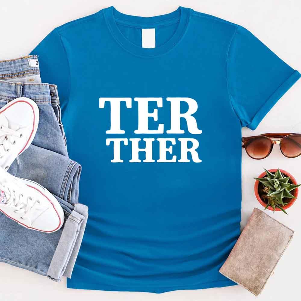 Couple wearing matching Better Together Couples Tee smiling outdoors
