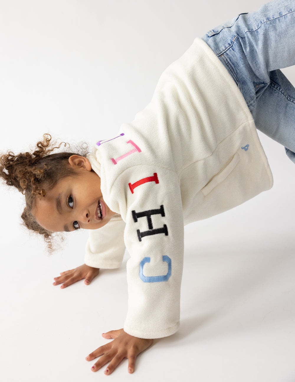 Cream oversized Child of God fleece kids pullover with faith-inspired embroidery and super soft polyester fabric