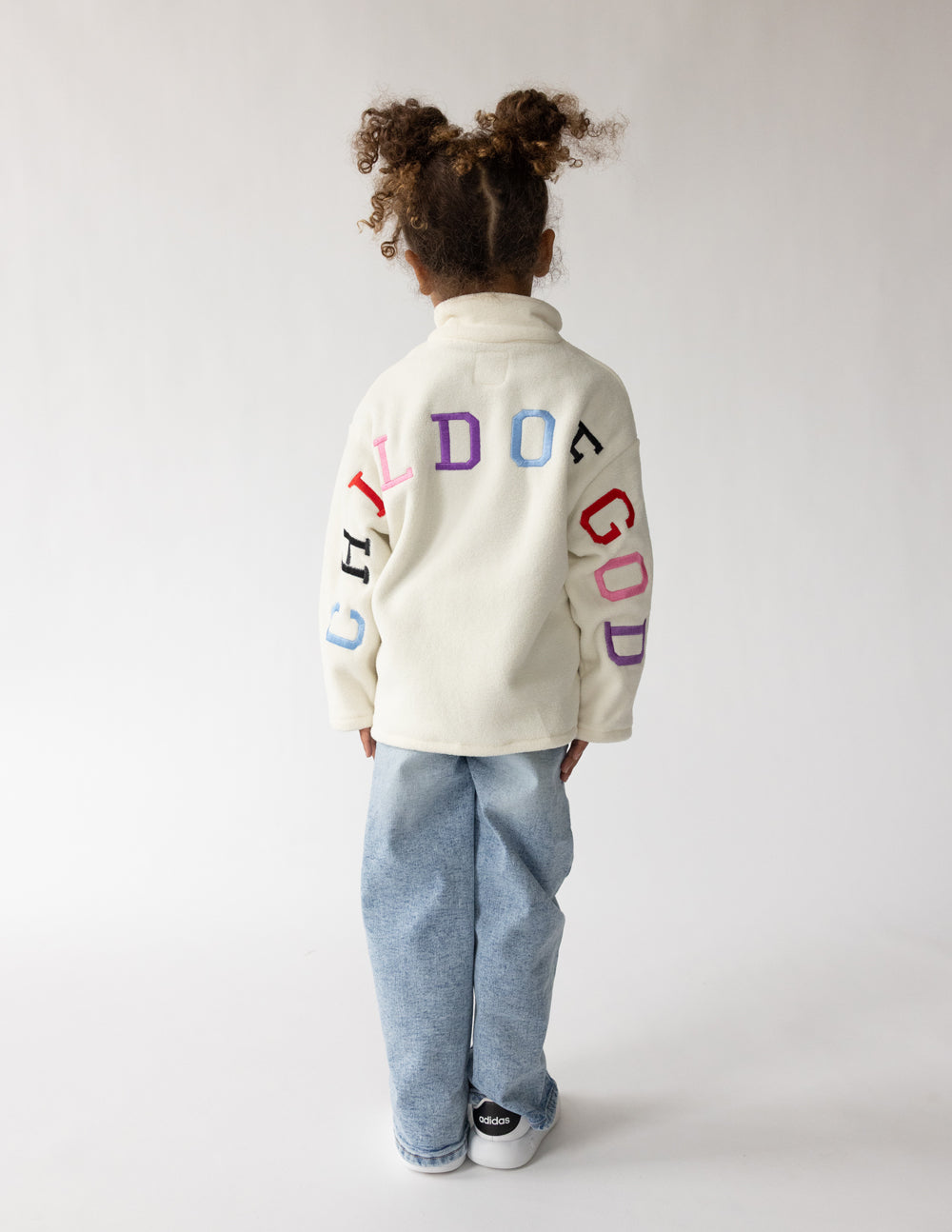 Child of God fleece kids pullover in cream with embroidered faith design and oversized fit