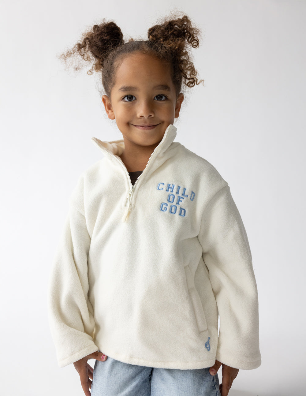 Cream oversized Child of God fleece kids pullover with embroidered faith design and soft polyester fabric