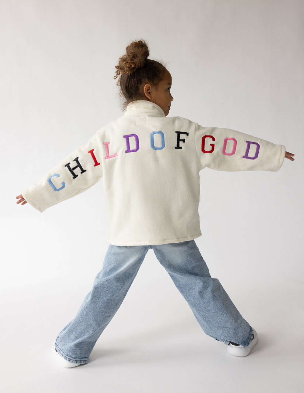 Cream Child of God fleece kids pullover with oversized fit and embroidered details