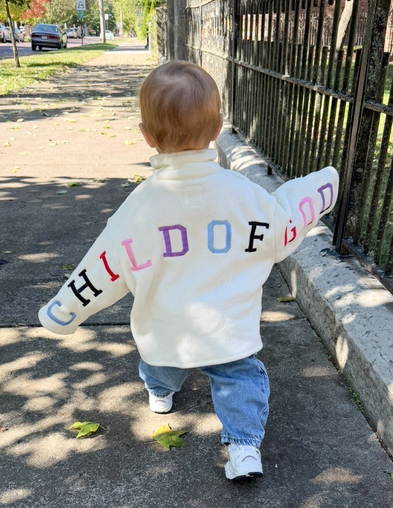 Cream Child of God fleece kids pullover with embroidery, oversized fit, and ultra-soft polyester fleece