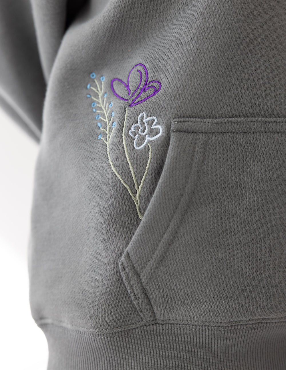 Child wearing Sedona Sage God's Still Working kids hoodie with oversized fit and embroidered Psalm 138:8 design