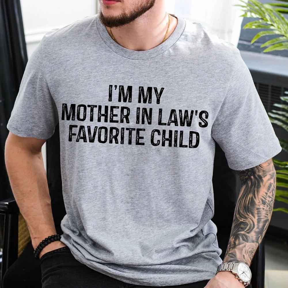 Unisex funny t-shirt with "I'm My Mother-In-Law's Favorite Child" text for family gatherings and casual wear