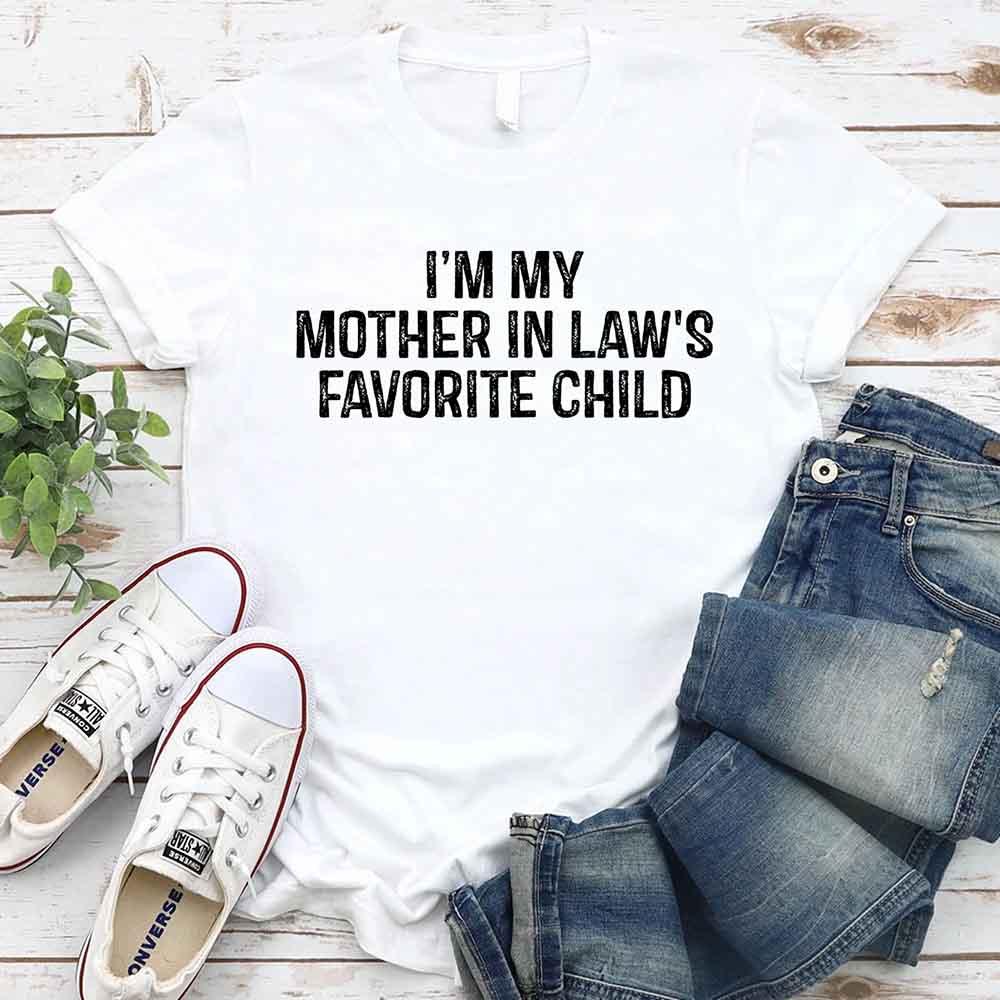Unisex t-shirt with "I'm My Mother-In-Law's Favorite Child" funny family joke print, comfortable cotton blend perfect for casual wear and family gatherings