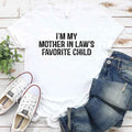 Unisex t-shirt with "I'm My Mother-In-Law's Favorite Child" funny family joke print, comfortable cotton blend perfect for casual wear and family gatherings