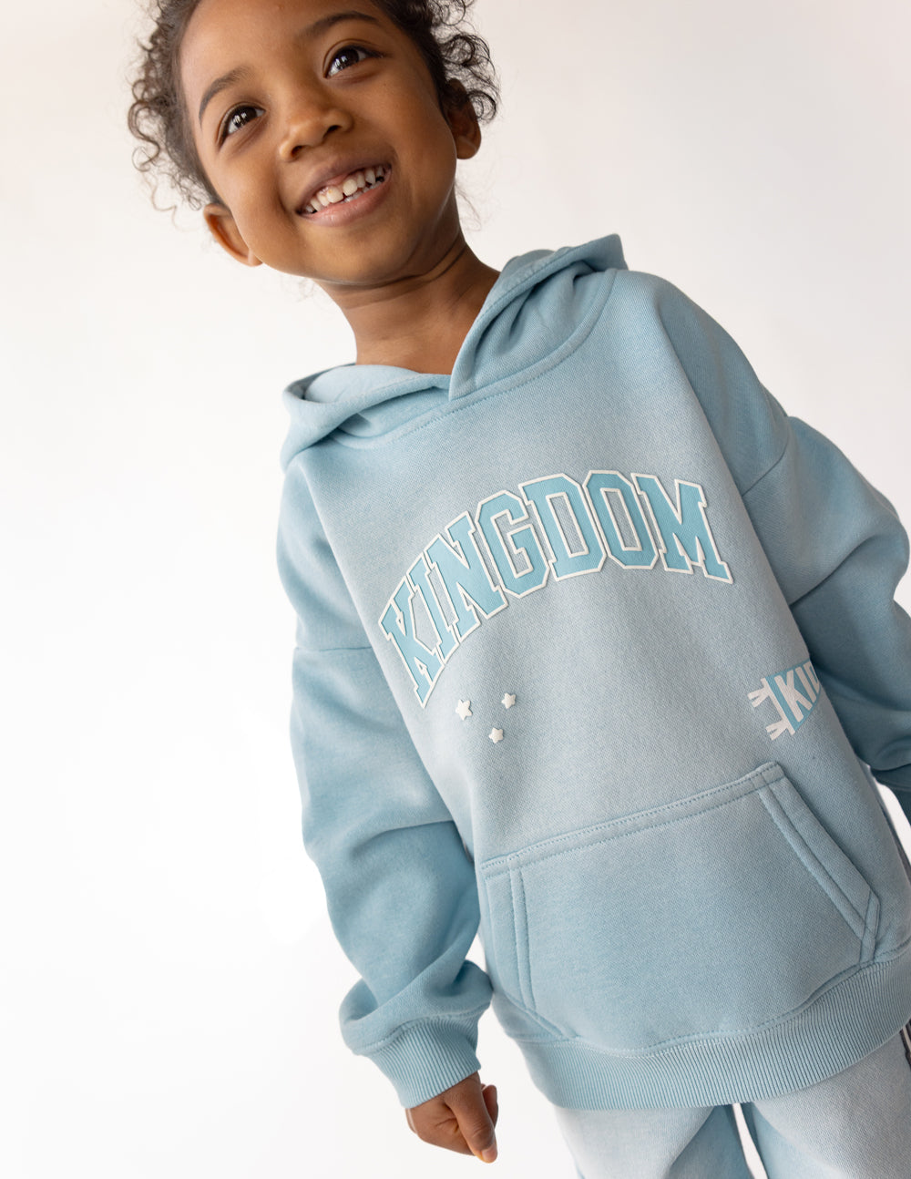 Kids oversized Kingdom Kids Hoodie in air blue with soft fabric and puff print design