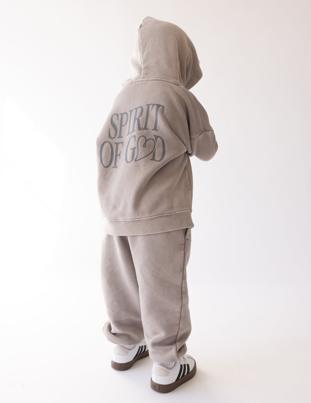 Kids wearing oversized Spirit of God hoodie in echo color, cozy and soft fabric, featuring 2 Corinthians 3:17 quote