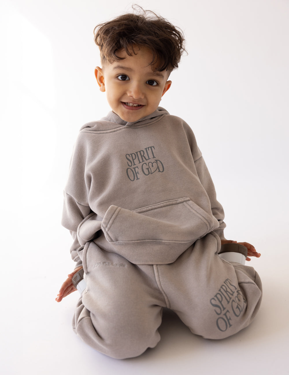 Kids wearing Spirit of God oversized hoodies in echo color, cozy and soft for cooler days