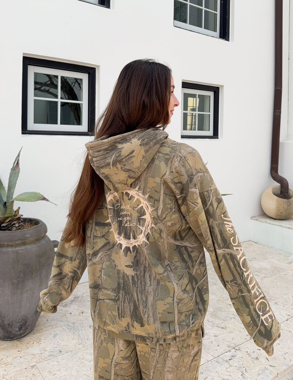The Sacrifice Camo Hoodie forest camo unisex hoodie with 1 Corinthians 15:55 scripture and garment dyed unique color variations