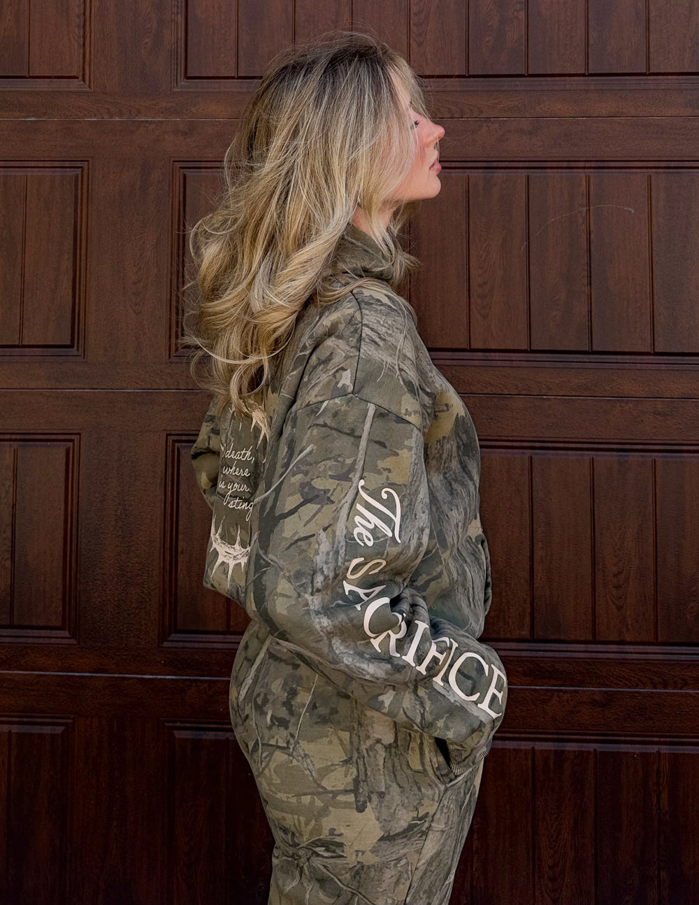 Unisex forest camo hoodie with 1 Corinthians 15:55 scripture and unique garment dye finish