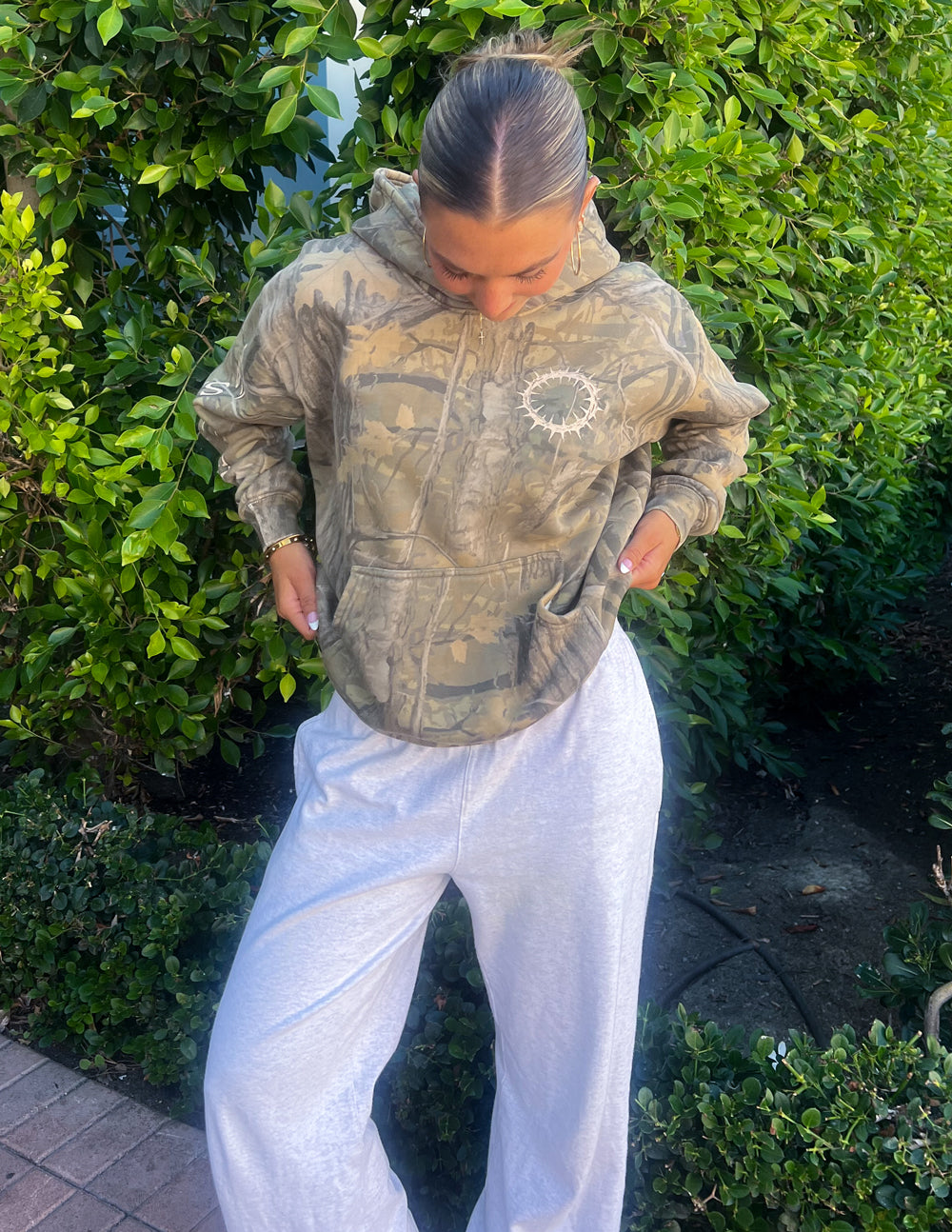Unisex forest camo hoodie with 1 Corinthians 15:55 verse and relaxed fit, garment dyed and super soft Sacrifice Camo Hoodie