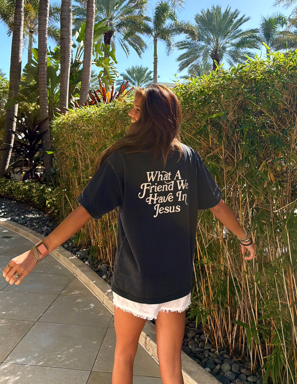 Black heavyweight cotton tee with "What a Friend in Jesus" text and John 15:15 quote, modern relaxed fit.