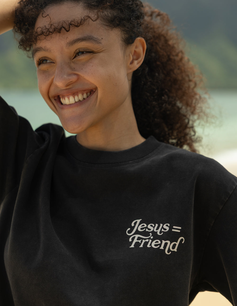 Black heavyweight cotton tee with "What a Friend in Jesus" and John 15:15 scripture, modern relaxed fit