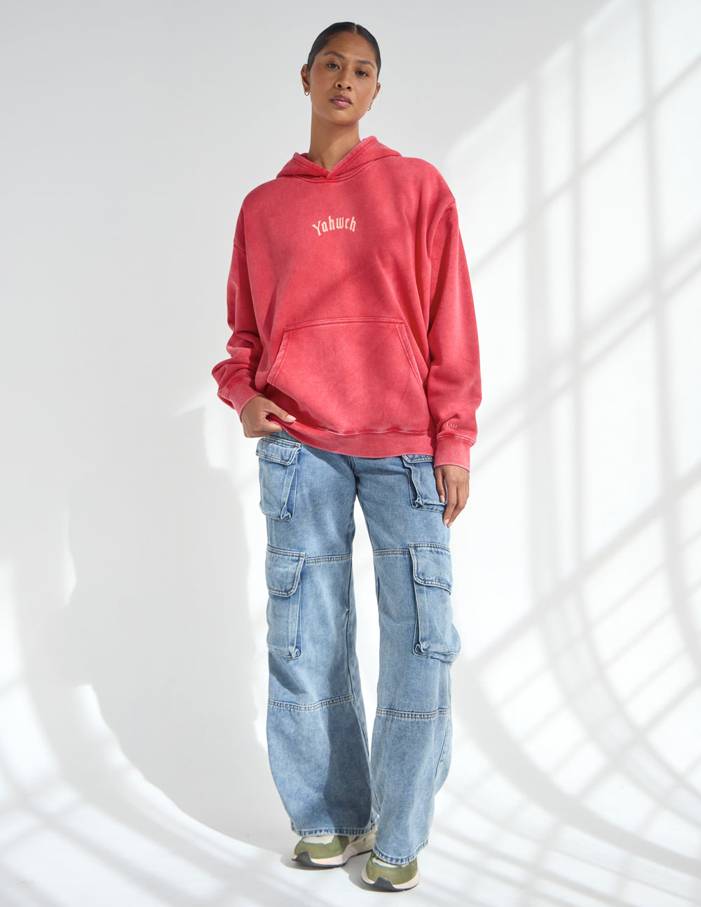 Yahweh Unisex Hoodie in ribbon red with Exodus 3:14 scripture, relaxed fit on model 5'10" wearing medium