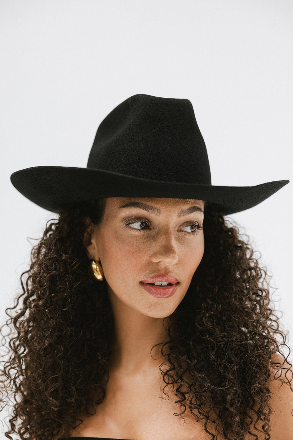 Lane Cowboy Hat with wide Western brim and unique brick top crown, hand-shaped for a classic yet edgy look