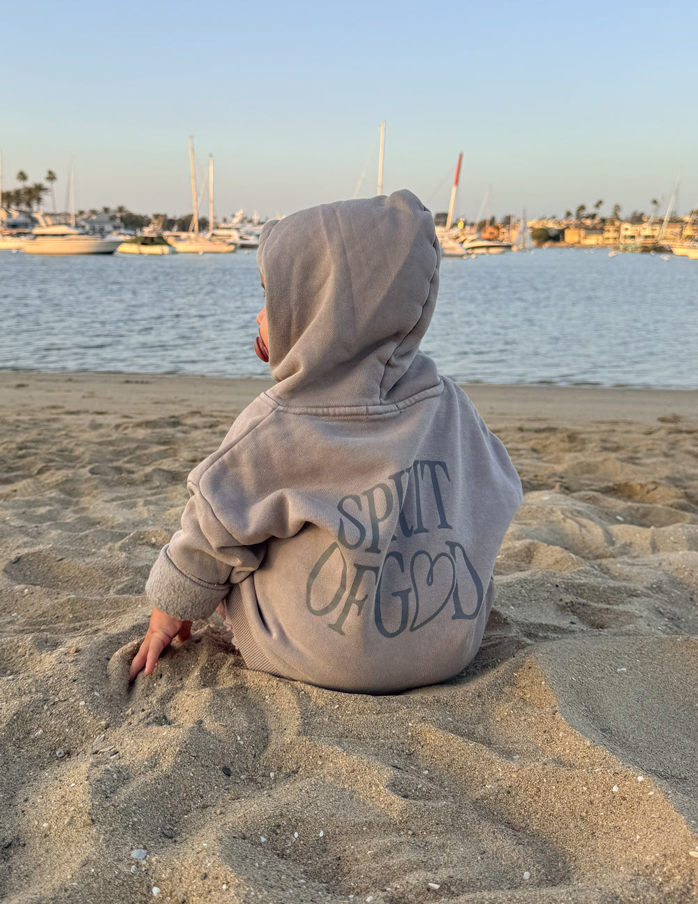 Kids wearing oversized Spirit of God hoodie in echo color, soft cotton blend, featuring 2 Corinthians 3:17 scripture design